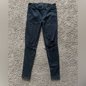 Knee-Ripped Black American Eagle Skinny Jeans